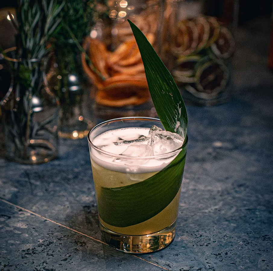 Premium cocktail served at dejavunyc lounge with elegant presentation